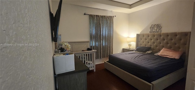 bedroom featuring dark hardwood / wood-style floors