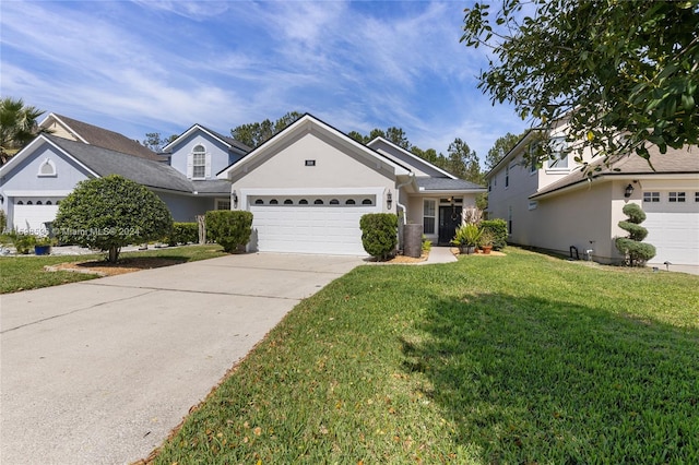 view of front of property featuring a garage and a front yard