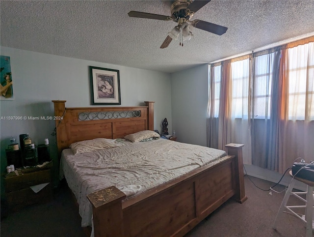 bedroom with carpet, a textured ceiling, and ceiling fan