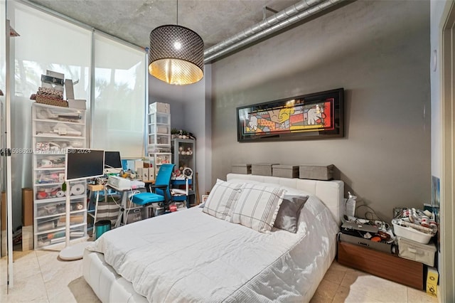 bedroom featuring light tile patterned floors