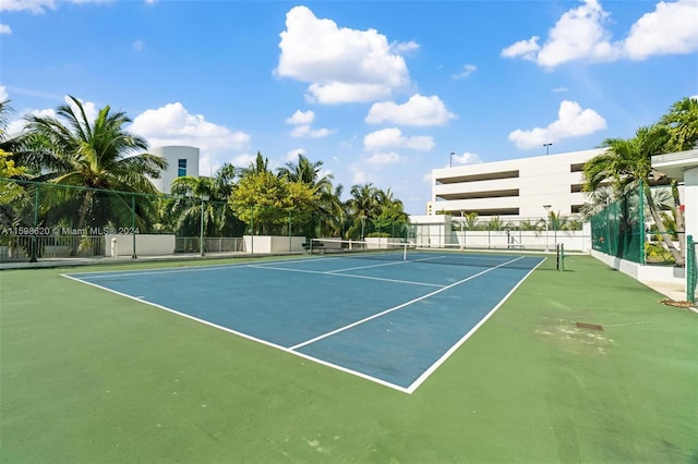 view of sport court with basketball hoop