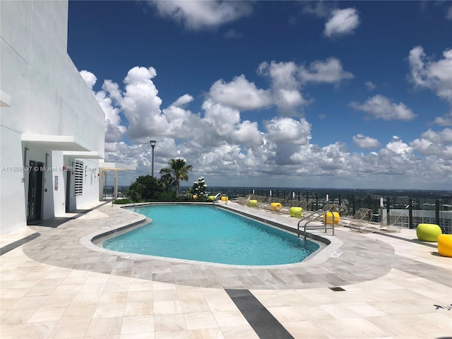 view of pool featuring a patio