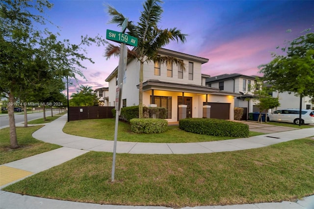 view of front of property with a lawn