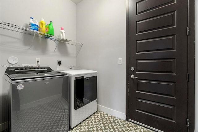 laundry area featuring independent washer and dryer and light tile patterned floors