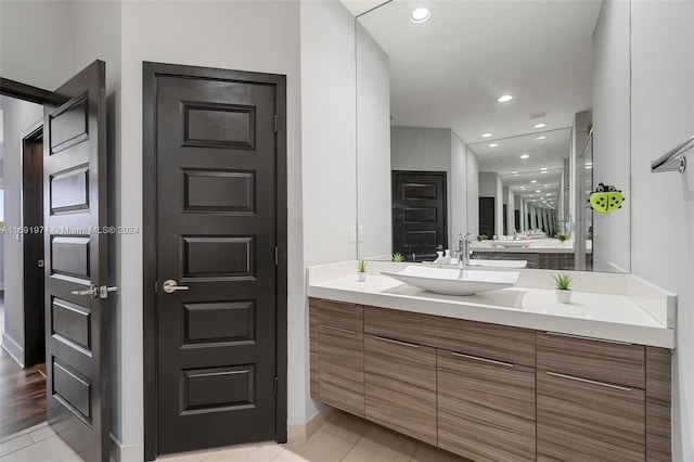 bathroom with tile patterned flooring and vanity