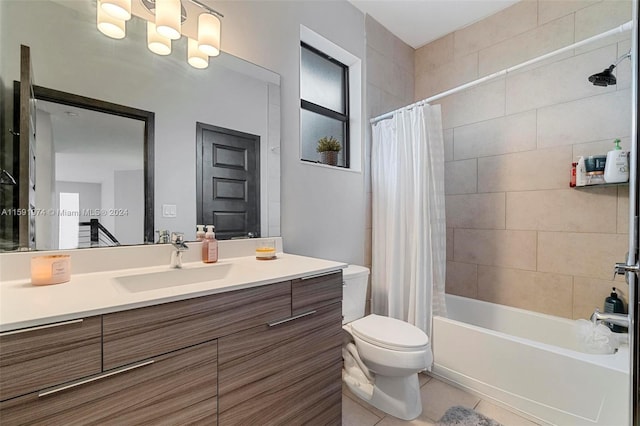 full bathroom featuring tile patterned floors, vanity, shower / bathtub combination with curtain, and toilet