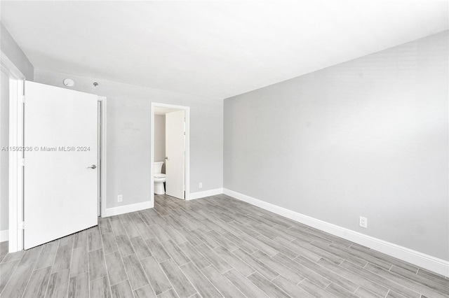 spare room featuring light wood-type flooring