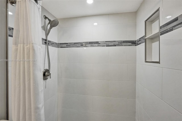 bathroom featuring a shower with curtain