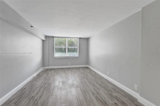 empty room featuring wood-type flooring