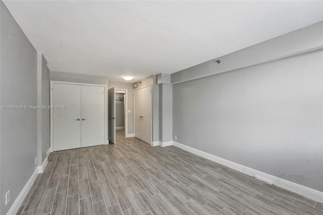 unfurnished room featuring light hardwood / wood-style floors