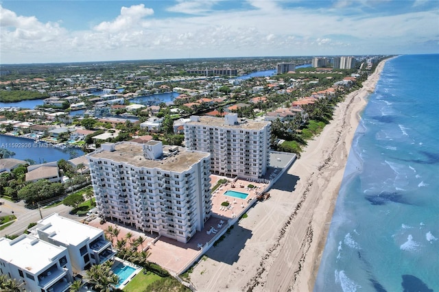 drone / aerial view with a water view and a view of the beach