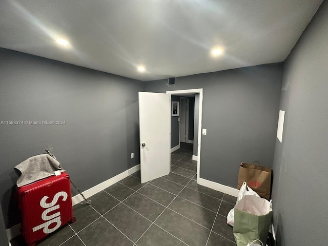 interior space featuring dark tile floors