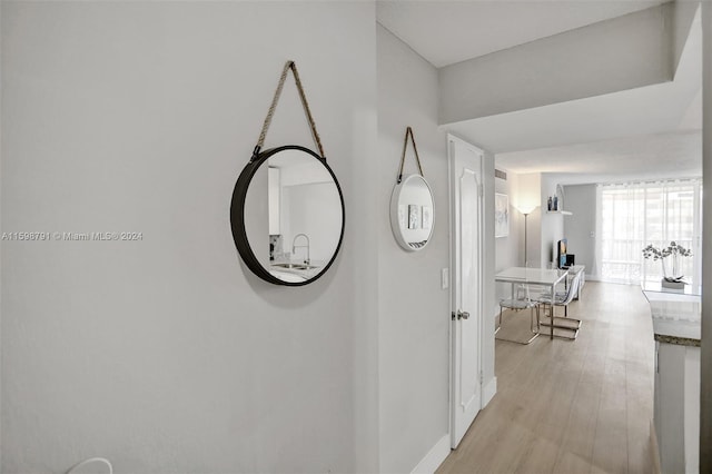 corridor featuring light hardwood / wood-style flooring