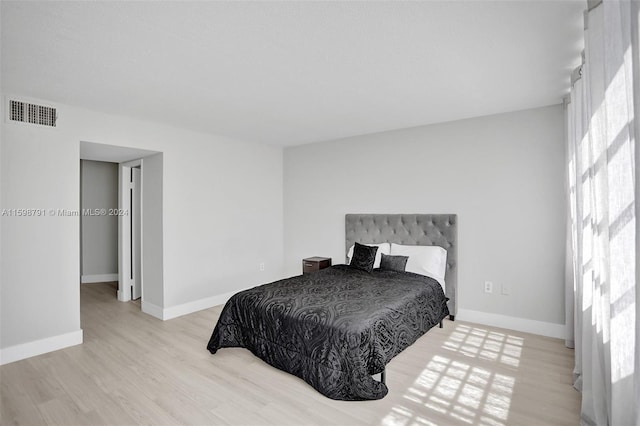 bedroom with light hardwood / wood-style flooring