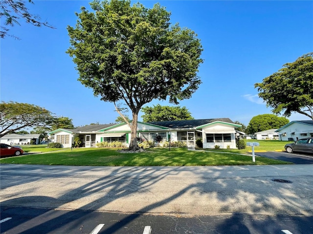 ranch-style house with a front yard