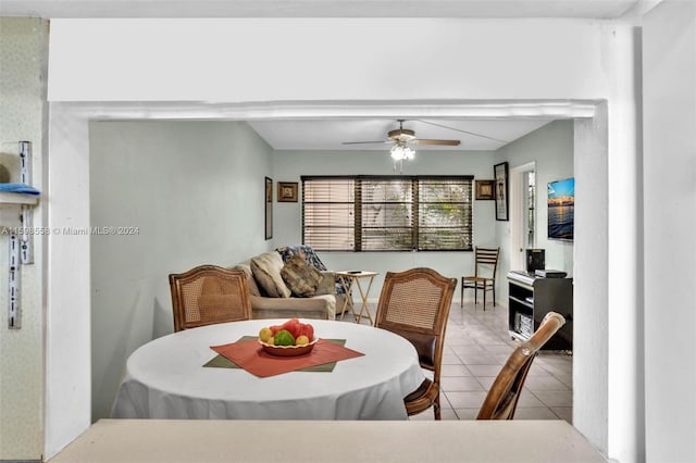 tiled dining room with ceiling fan