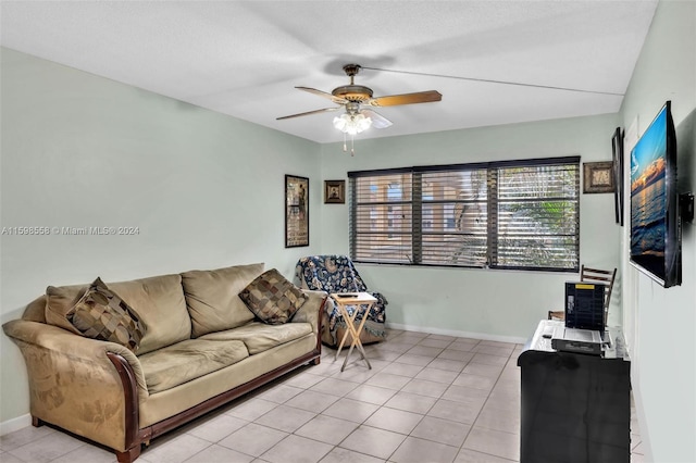 tiled living room with ceiling fan