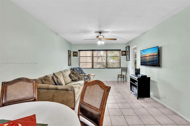 living room with light tile patterned floors and ceiling fan