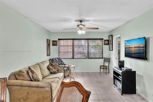 living room with ceiling fan and light tile patterned floors