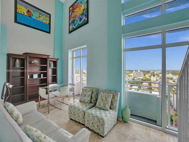 living room with a towering ceiling