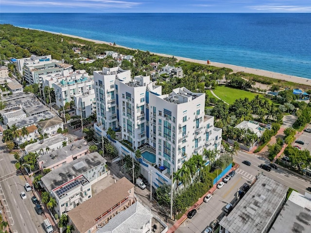 aerial view featuring a water view and a view of the beach