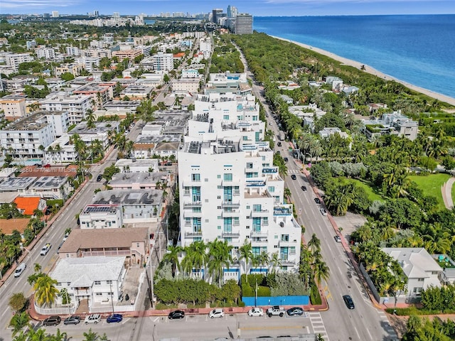 aerial view featuring a water view and a beach view