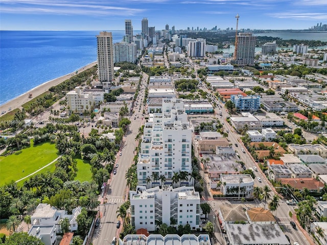 bird's eye view with a beach view and a water view