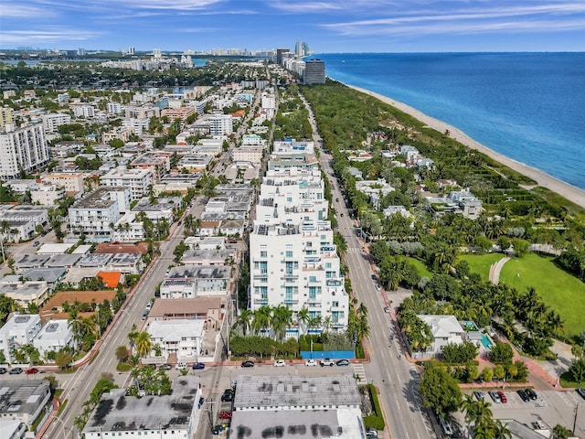 drone / aerial view featuring a view of the beach and a water view