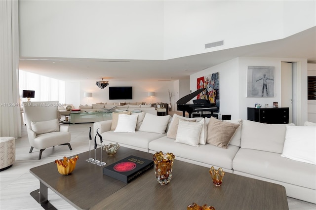 living room with a high ceiling