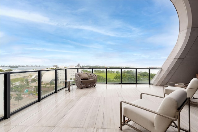 balcony featuring a water view