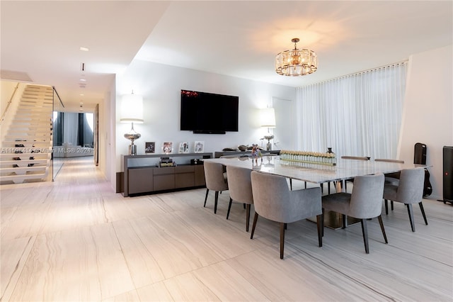 dining space with a notable chandelier