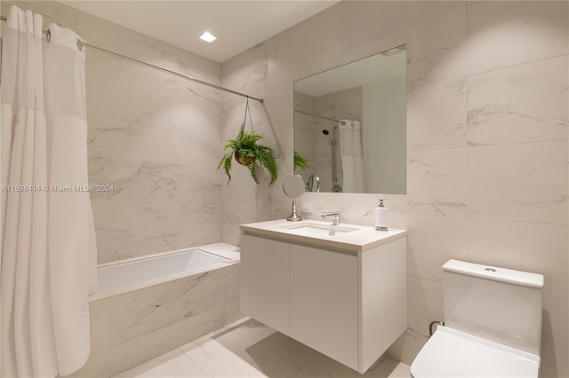 full bathroom with shower / bath combination with curtain, vanity, toilet, and tile walls