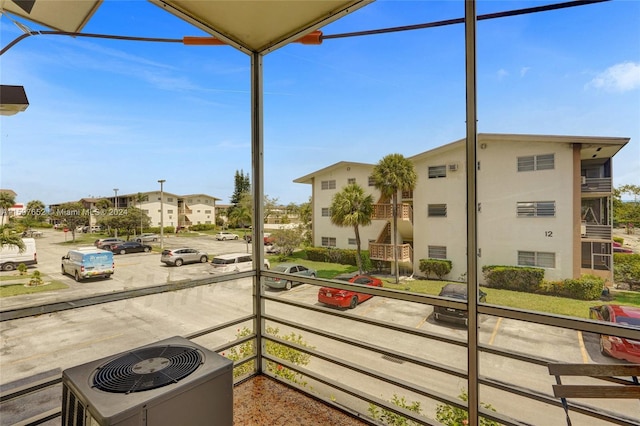 view of patio / terrace featuring a balcony and central AC unit