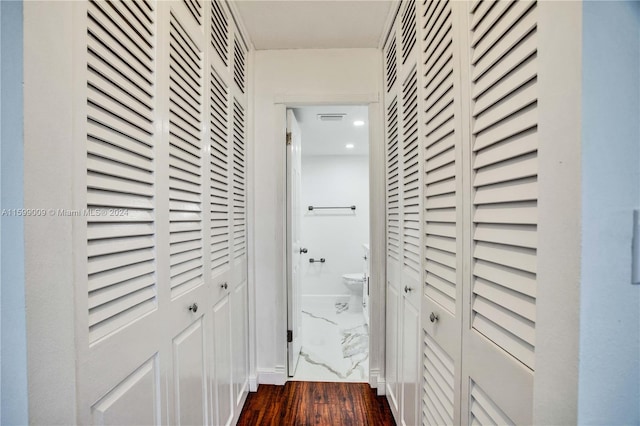 hallway featuring dark hardwood / wood-style flooring