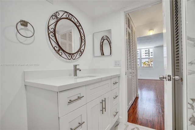 bathroom featuring hardwood / wood-style floors and vanity