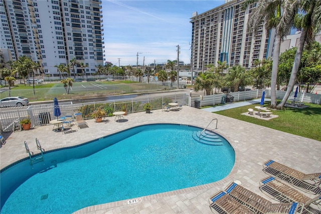 view of swimming pool with a patio