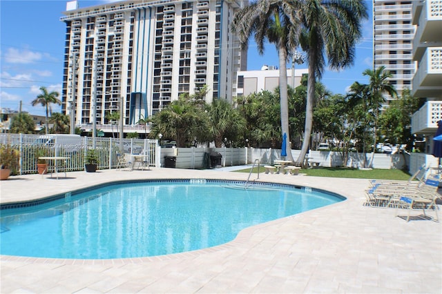 view of swimming pool featuring a patio area