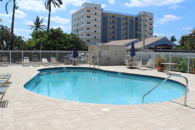 view of swimming pool with a patio