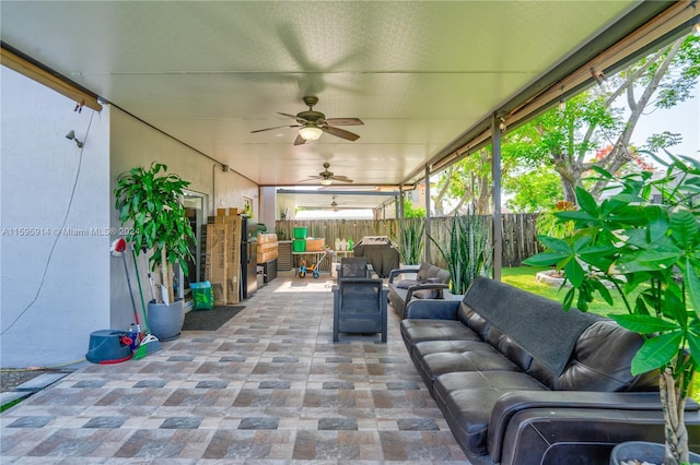 view of patio featuring area for grilling, an outdoor hangout area, and ceiling fan