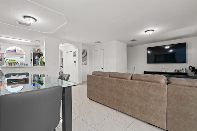 living room with light tile patterned floors