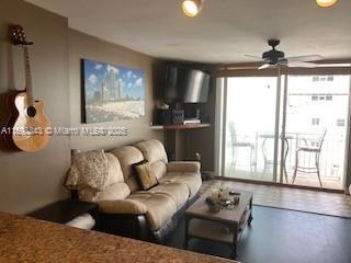 living room with a ceiling fan