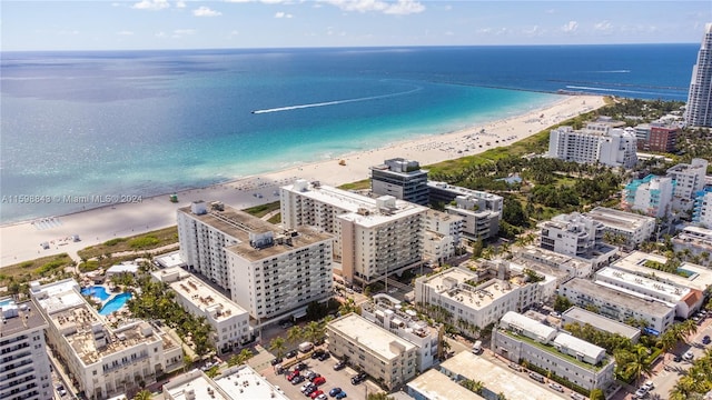 aerial view featuring a water view and a view of the beach