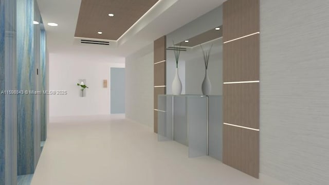 hall with recessed lighting and visible vents