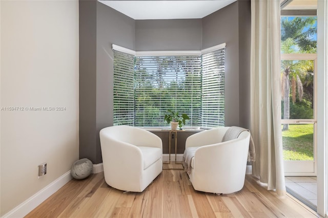 sitting room with light hardwood / wood-style floors