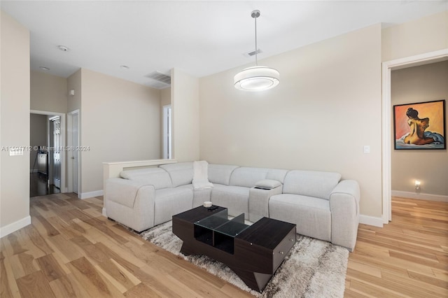 living room with light hardwood / wood-style flooring