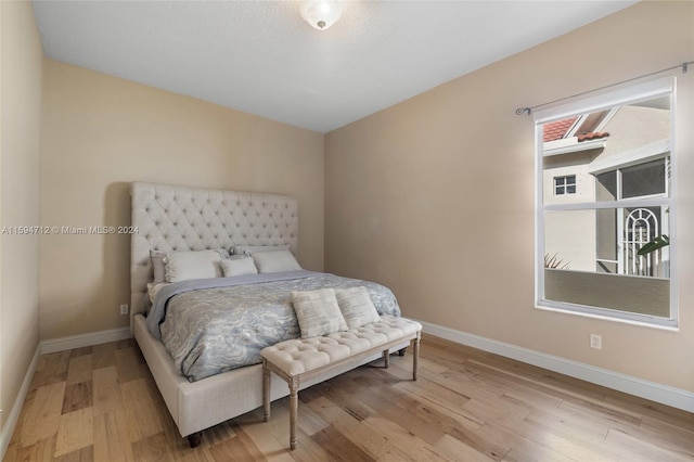 bedroom featuring hardwood / wood-style floors