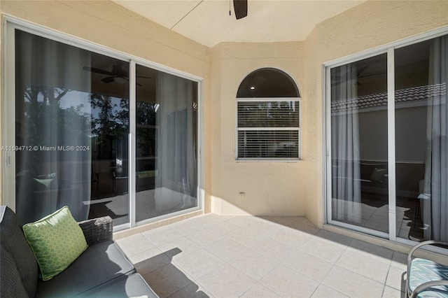 view of patio featuring ceiling fan