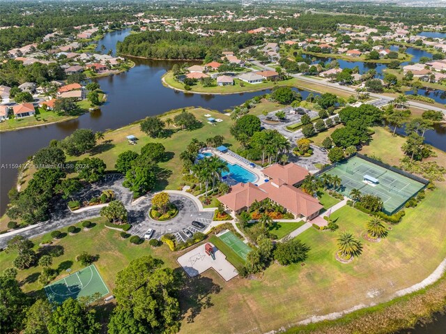 birds eye view of property with a water view