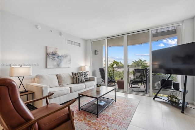 living room with a wealth of natural light and a wall of windows