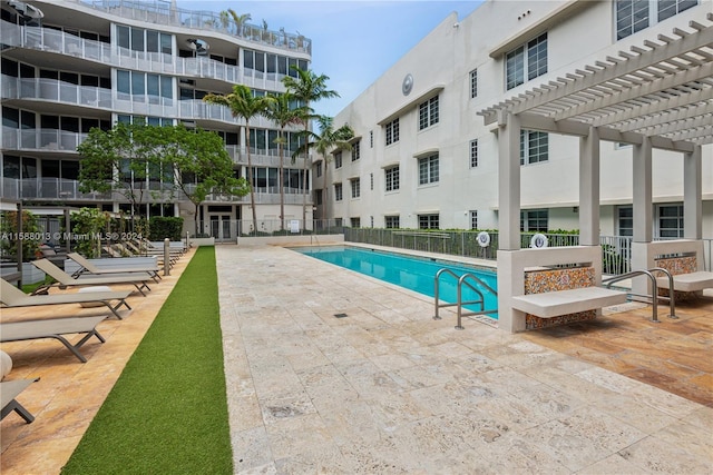 view of pool featuring a pergola and a patio area